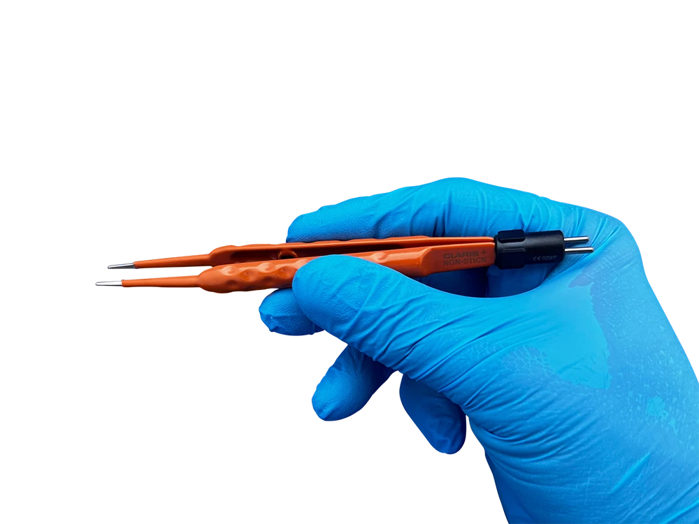 Surgeon holding 140mm straight bipolar forceps with non stick silver tips and ergonomic insulated handle for precision microsurgery